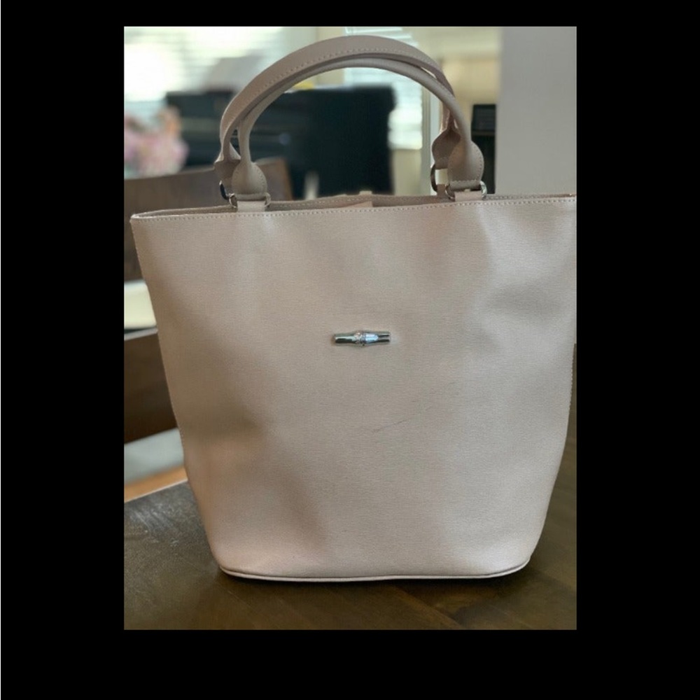 Authentic Longchamp leather shoulder bag/tote in a light blush/tan color.